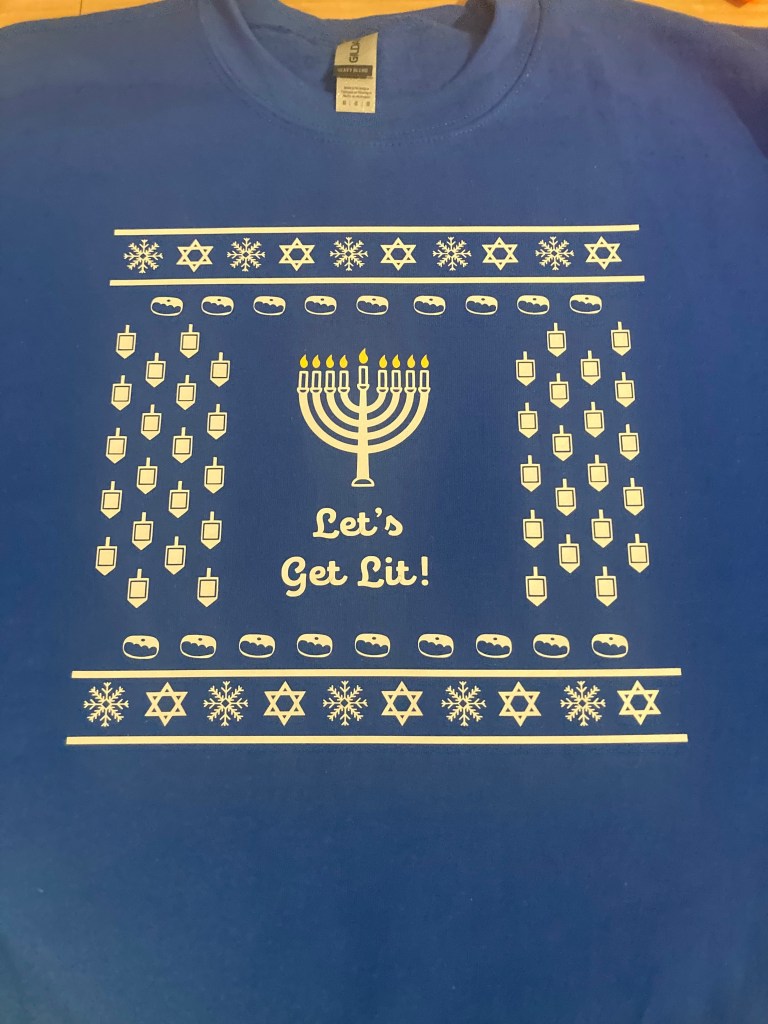 A holiday sweater with a menorah on it
