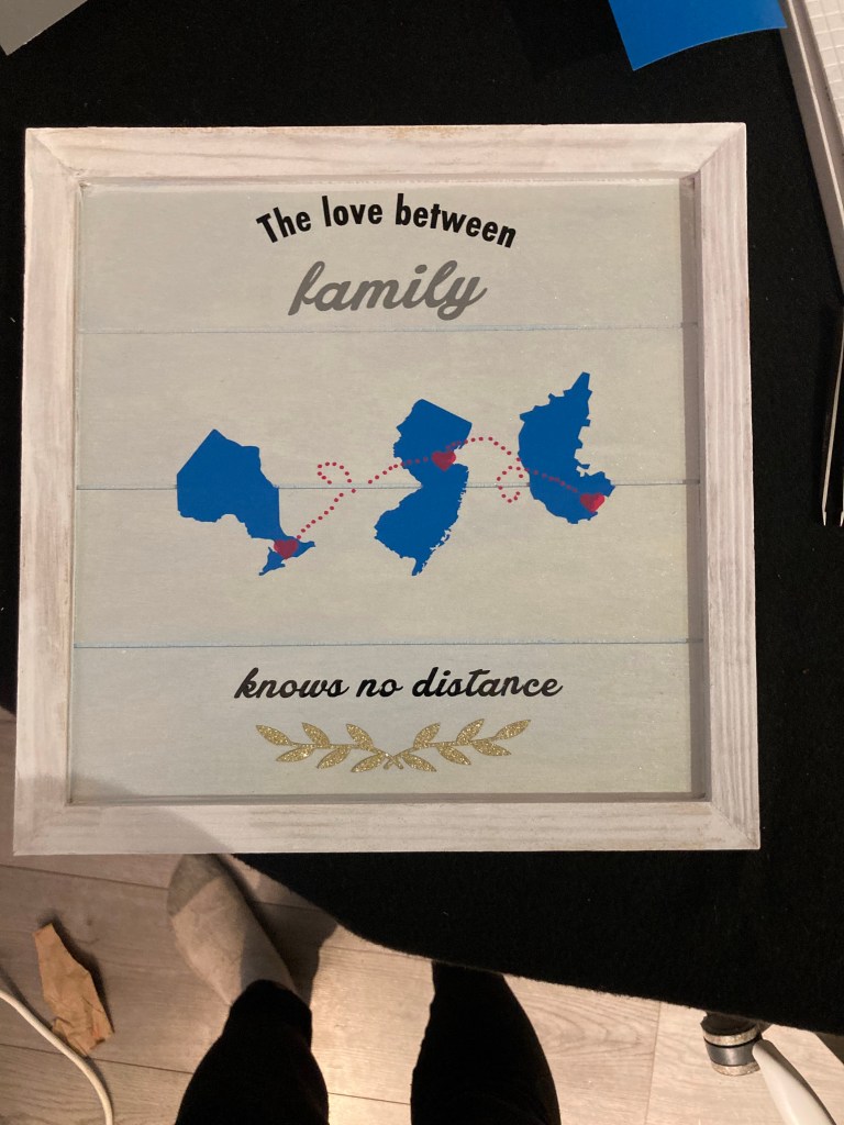 A wooden board with the cut outs of cities and provinces