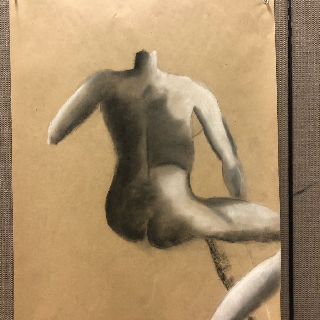 Conte sketch of a person posing