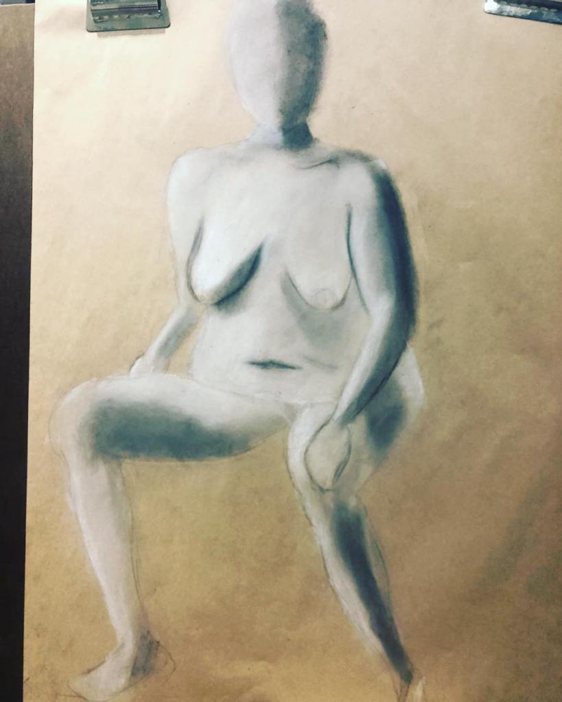 Conte sketch of a person posing